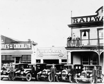 Drivers and their taxis outside Aard's Taxi Service