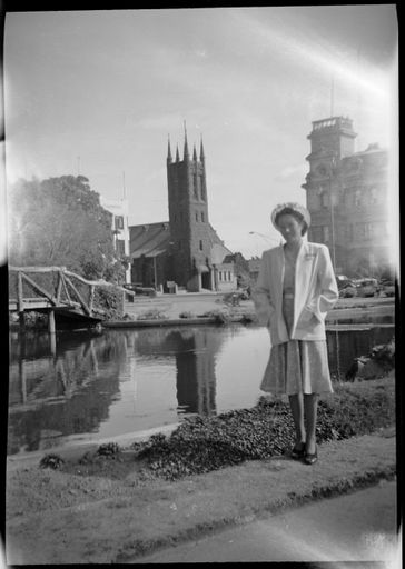 Woman standing in front of the Buttlerfly Lake in The Square, All Saints' Church behind - Resource cover image