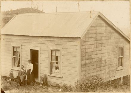 Mr and Mrs Ralfe outside cottage