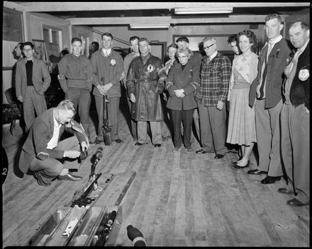 "Auckland Contestant Prepares his Rifle for Final Shot"