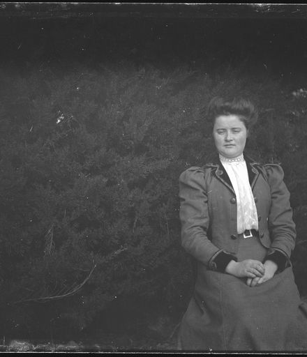 Woman Seated By Tree
