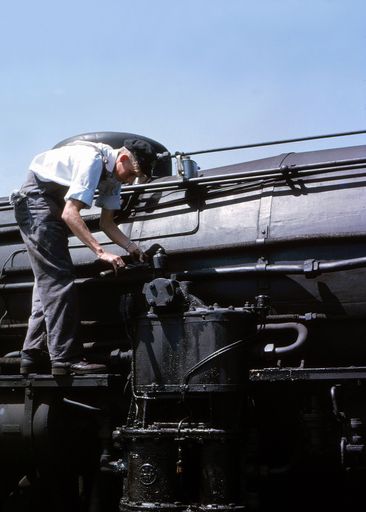Railways worker operating a pump