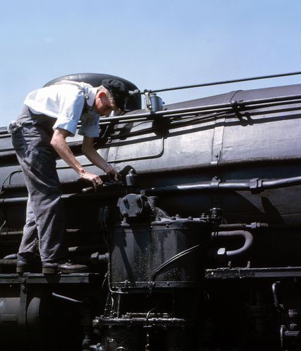 Railways worker operating a pump