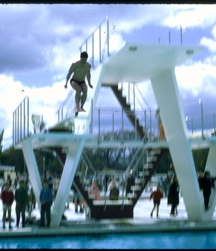 Swimmers Jump from Diving Board - Opening of Lido Swimming Complex