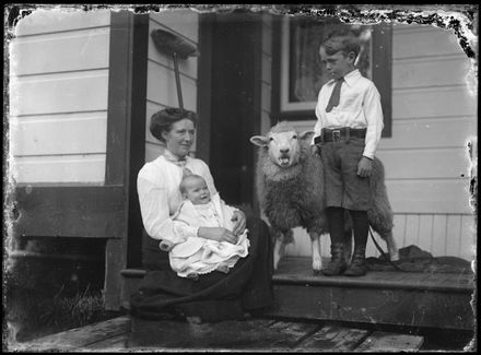 Woman and Children with Pet Sheep