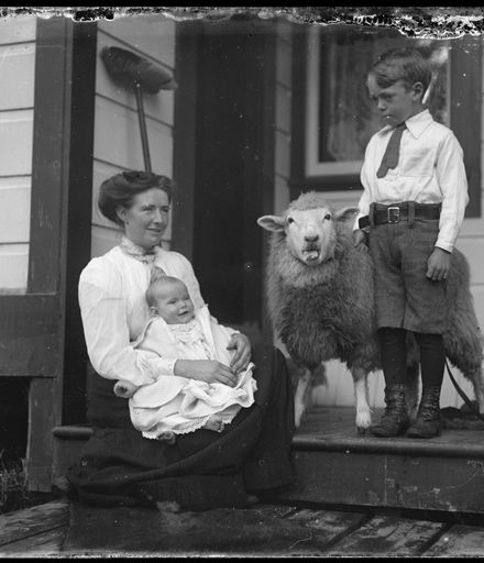 Woman and Children with Pet Sheep