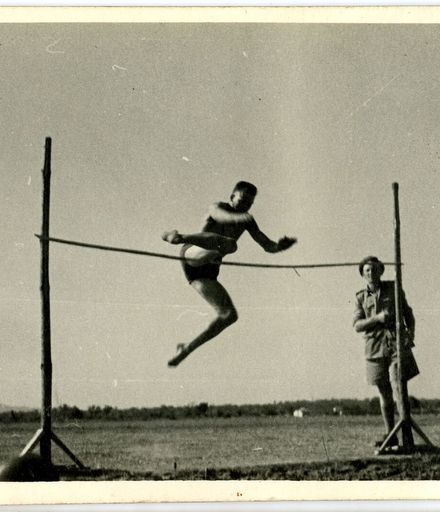 "Soak" Grammer doing the high jump at the regimental  sports