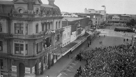 Queen Elizabeth II waving to crowds from the Grand Hotel