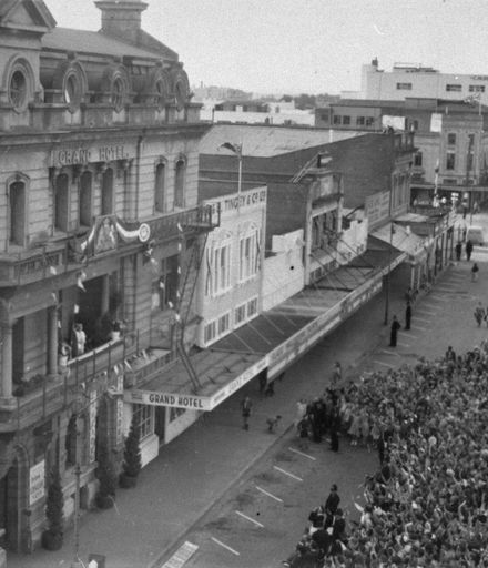 Queen Elizabeth II waving to crowds from the Grand Hotel