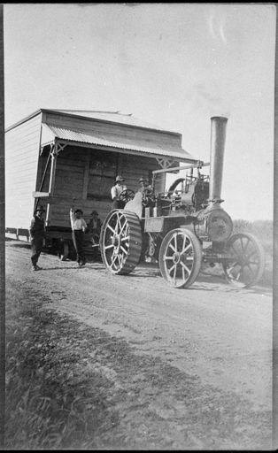 Traction Engine Hauling a section of a Farmhouse