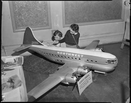 "The Giant and the Mites" - Children admiring a model aircraft - Resource cover image