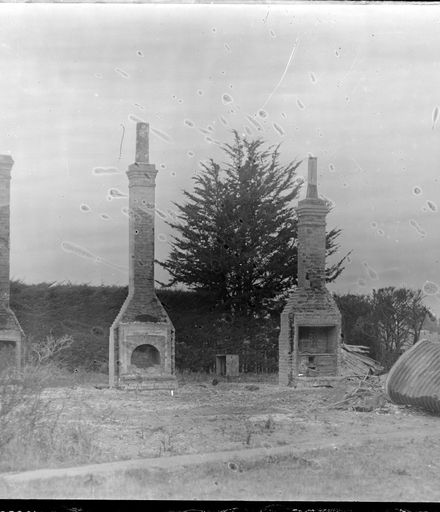 Chimneys from Demolished House Left Standing