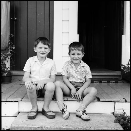 Two children sitting on a step - Resource cover image