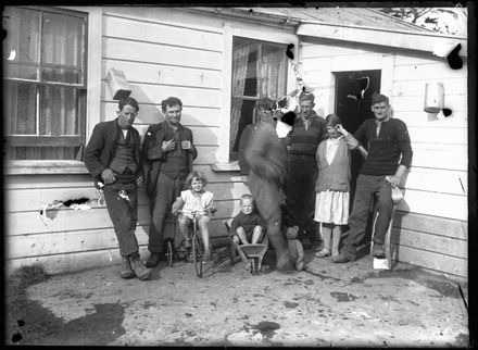 Unidentified group outside house
