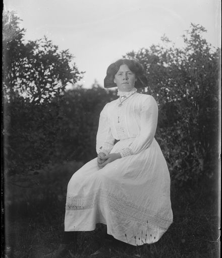 Young Woman Seated Amongst Trees