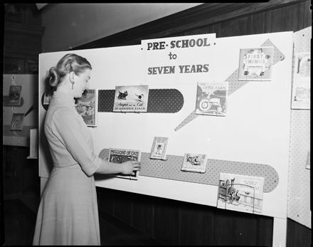 "Preparing Display of Children's Books" - Library