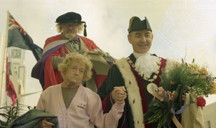 Madge Allsop escorted by Mayor Rieger