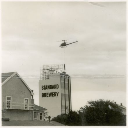 Helicopter Used in Installation of Standard Brewery Sign