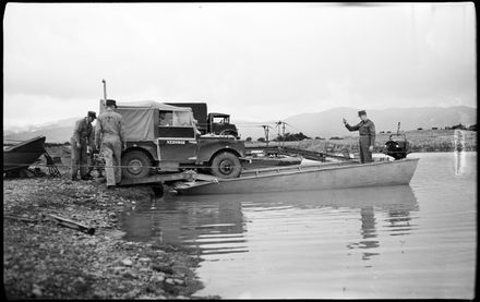 "Versatile Engineers Show Their Paces" - Army Engineers Loading Landrover onto Raft