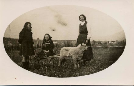 Unidentified Woman and Girls with Pet Sheep