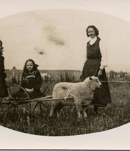 Unidentified Woman and Girls with Pet Sheep