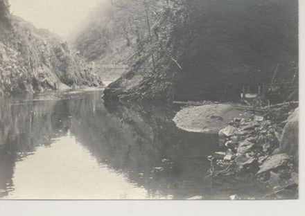 River gorge with wire bridge in distance