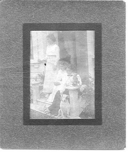 Three Unidentified Women With Dog on House Steps