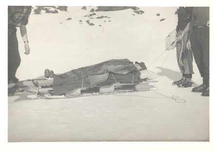 Men on Ski-field with rescue sled