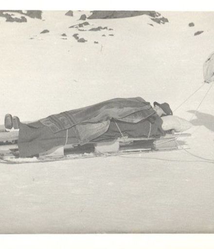 Men on Ski-field with rescue sled