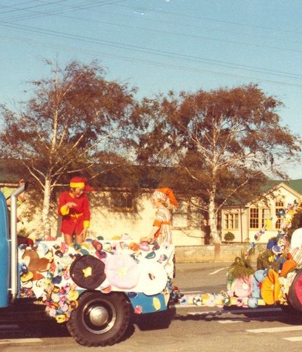 Unidentified group on blue truck with trailer, Shannon Christmas Parade, 1980's