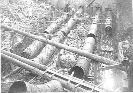 Connecting penstock pipes to power house, Mangaore, 1920's