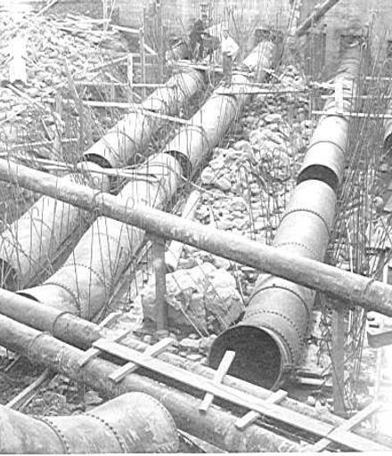 Connecting penstock pipes to power house, Mangaore, 1920's