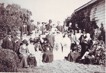 Unidentified large wedding group in garden