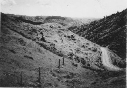 Looking down valley through hilly farmland, 1920's