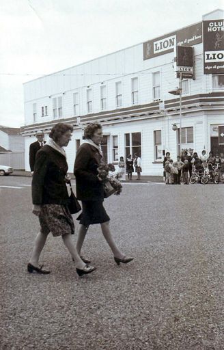 Vera Claridge and Margaret Donnelly about to lay Red Cross wreath, Anzac Day mid 1970's