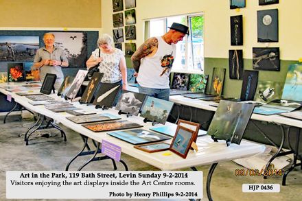 HJP 0436 Art in the Park, 119 Bath Street, Levin Sunday 9-2-2014 Visitors enjoying the art displays inside the Art Centre rooms.