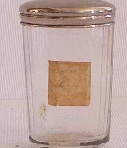 Glass jar with a silver lid.