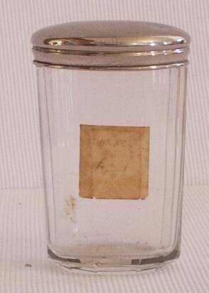 Glass jar with a silver lid.