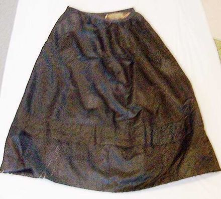 Long black satin skirt.