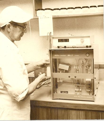 Mr Becht, butterfat testing unit, Kuku Dairy Factory, 1971