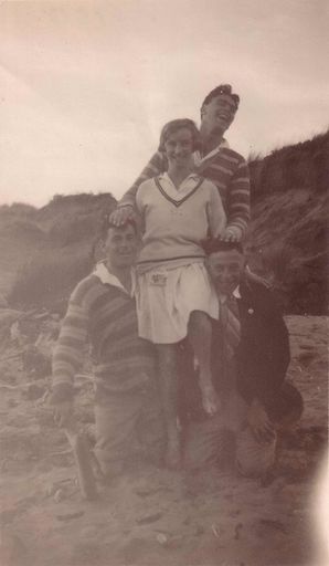 Group of four people on the beach, c.1930