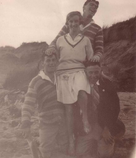 Group of four people on the beach, c.1930