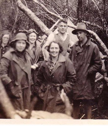 Members of tramping club at campsite in bush, October 1936