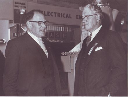 2 men near Textiles display, Electricity Exhibition 1972