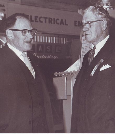 2 men near Textiles display, Electricity Exhibition 1972