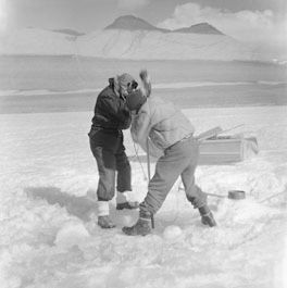 A Packard and Dr R Balham cut a hole through ice