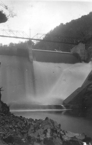 View from downstream showing water spilling over dam, Mangahao, 1936