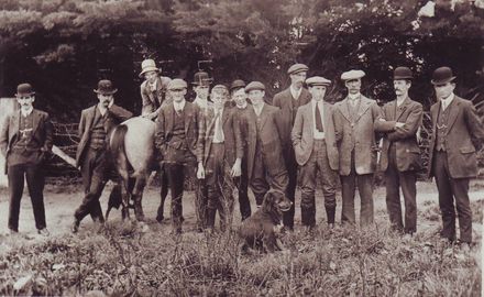 Group of 13 men waiting for Michael moynihan to 'open up' the Club Hotel, c.1912