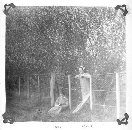 Hebe and Connie Blackburn beside fence