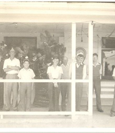 Group of young men on verandah at Kimberley, Christmas / New Year